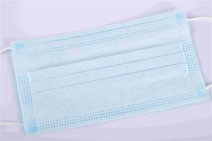 Close-up of 3-ply mask layers PP non-woven and melt-blown filter